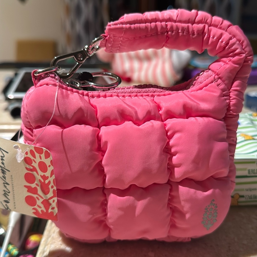 Free People Movement Quilted Micro Pouch in color bubblegum.